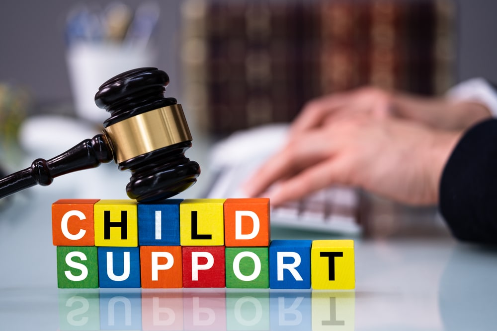 Judges Hammer With Child Support Toy Blocks