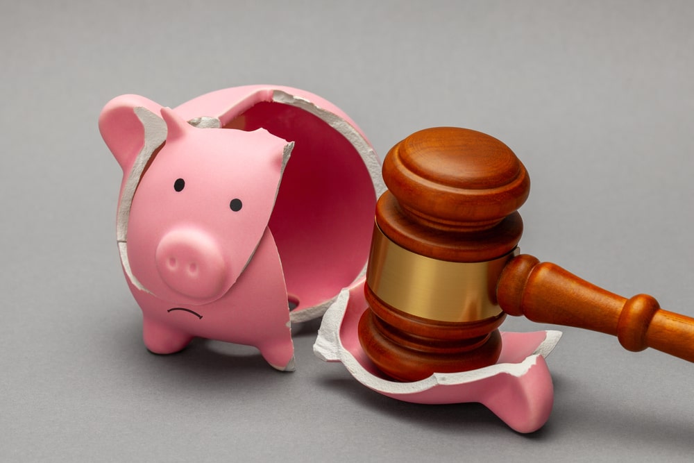 Piggy Bank Broken With Judges Hammer
